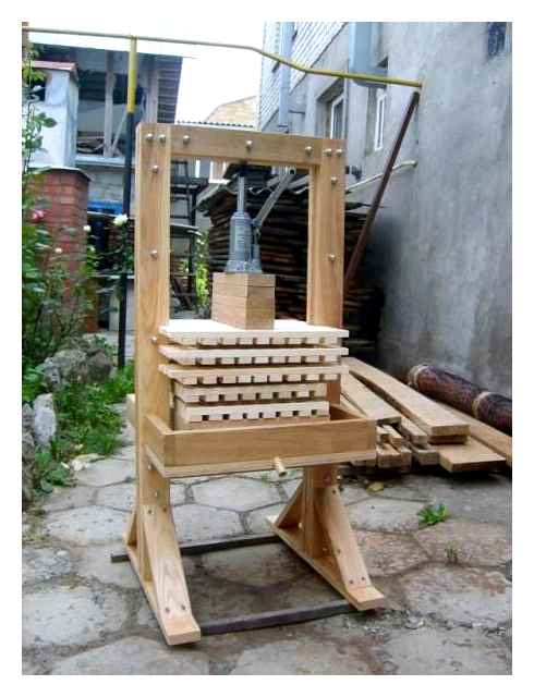 Makeshift wooden apple press